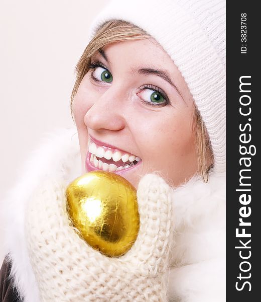 Closeup of young beautiful girl, wearing wool winter hat and scarf