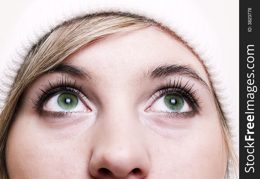 Closeup of young beautiful girl, wearing wool winter hat
