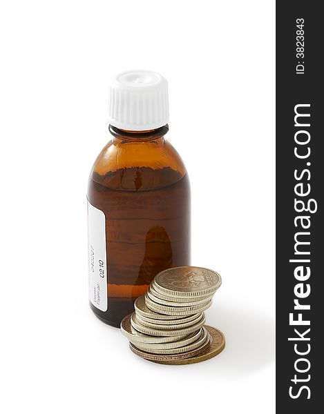 Brown bottle with a liquid medicine near some coins. Brown bottle with a liquid medicine near some coins