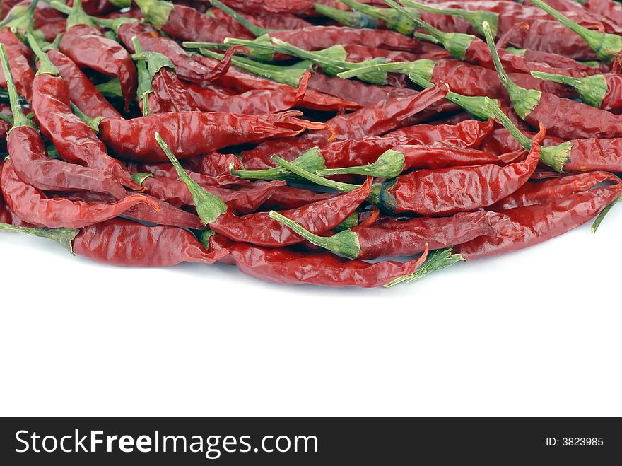 Pile of red peppers in white background