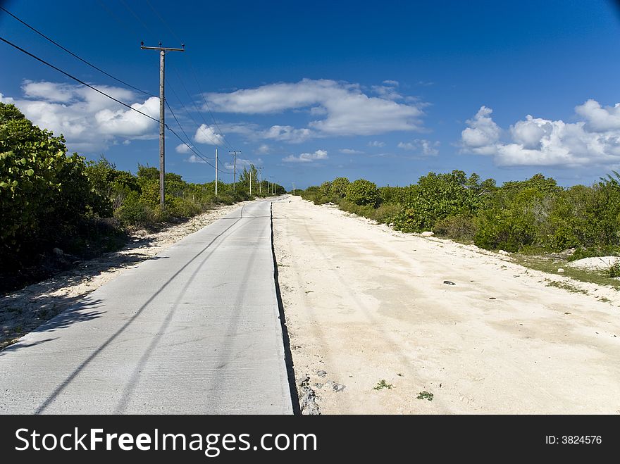 The half paved road on Anegada Island in the British Virgin Islands BVI. The half paved road on Anegada Island in the British Virgin Islands BVI