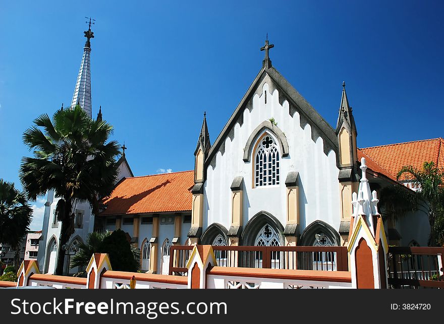 Belfry of church on the blue sky background