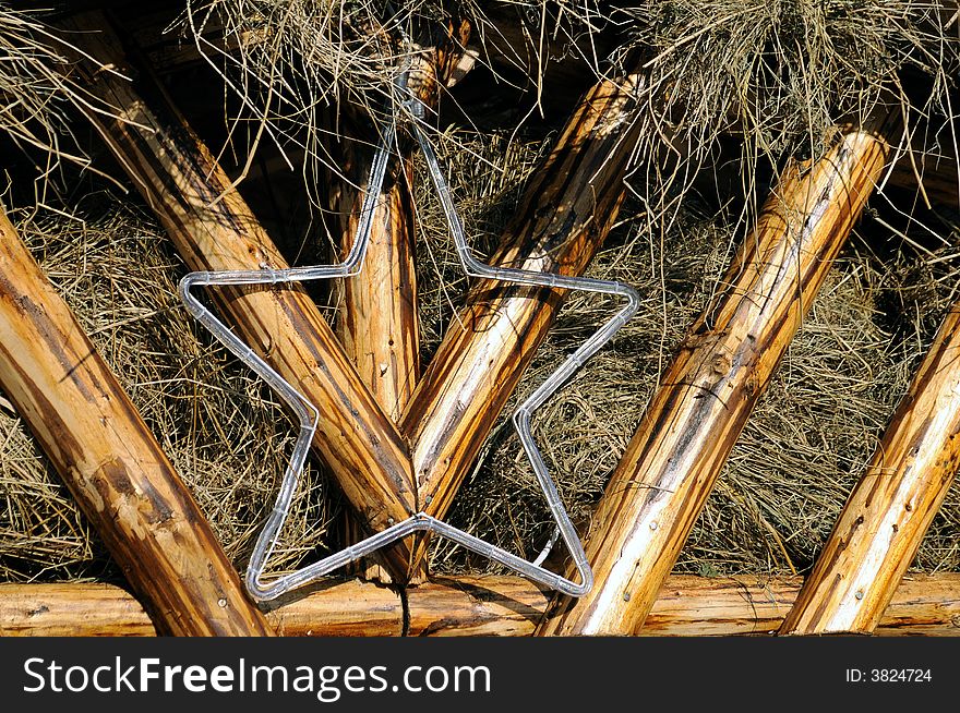 A Christmas star over a stable roof