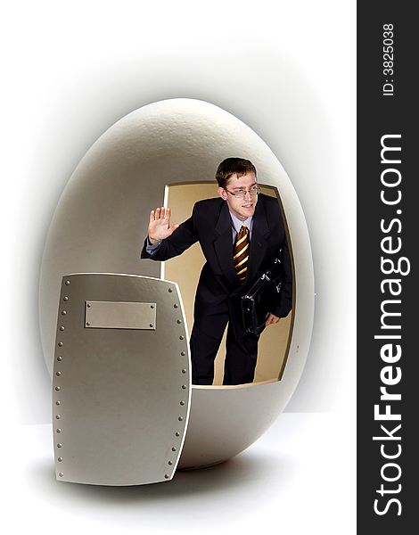 Young businessman with case broken big egg on white. Young businessman with case broken big egg on white