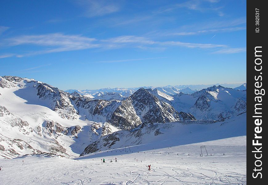 Sun over snowy mountain scene. Sun over snowy mountain scene