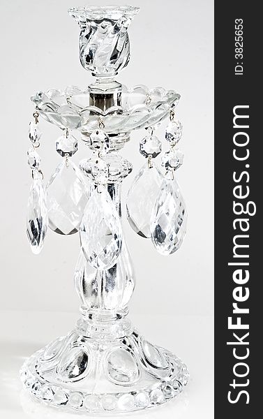 Glass candlestick on white background