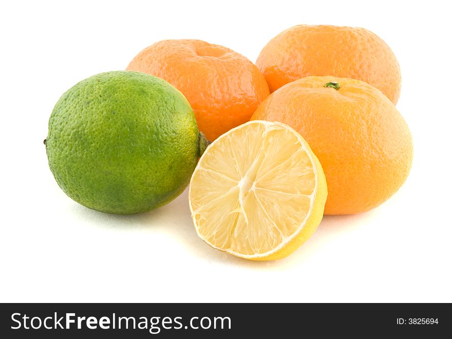 Oranges, lime and a lemon isolated on white. Oranges, lime and a lemon isolated on white.