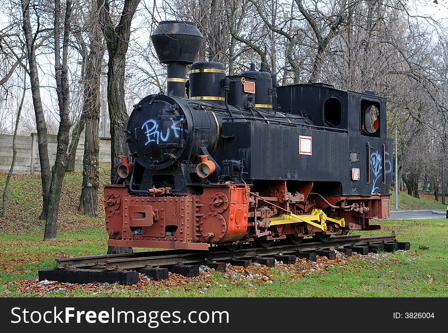 A view with an old locomotive in an outdoor museum