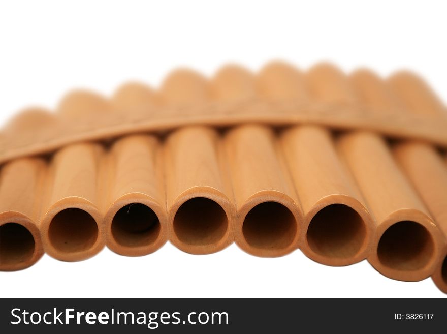 Wooden pan flute on a white background. It is isolated