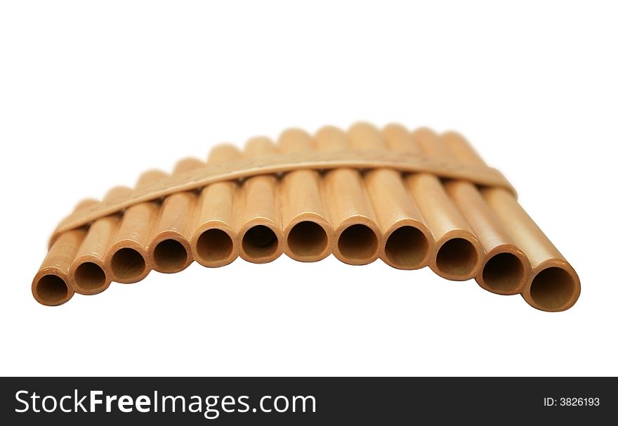 Wooden pan flute on a white background. It is isolated