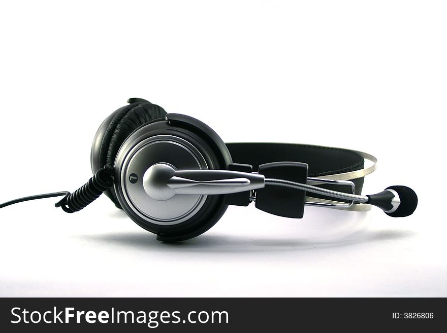 Silver - black headphones with microphone on white background (isolated)