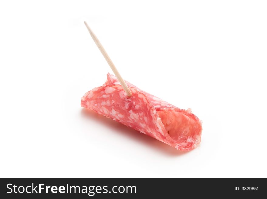 Slice of salami on a toothpick