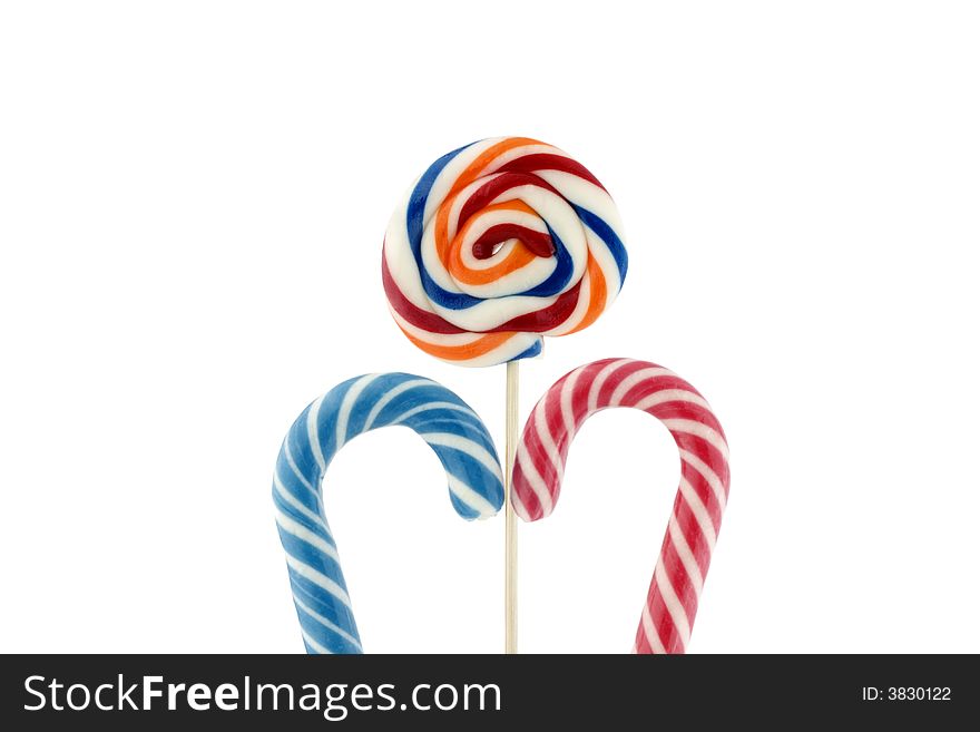 Candy cane and colorful suckers isolated on white background