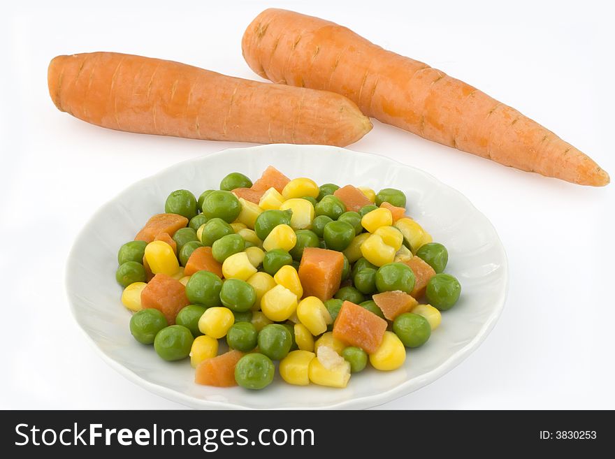 Vegetables and two carrots isolated on white background