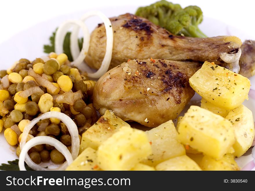 Roasted chicken with roasted potatoes and garden vegetables