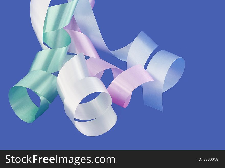 Four ribbons over blue background