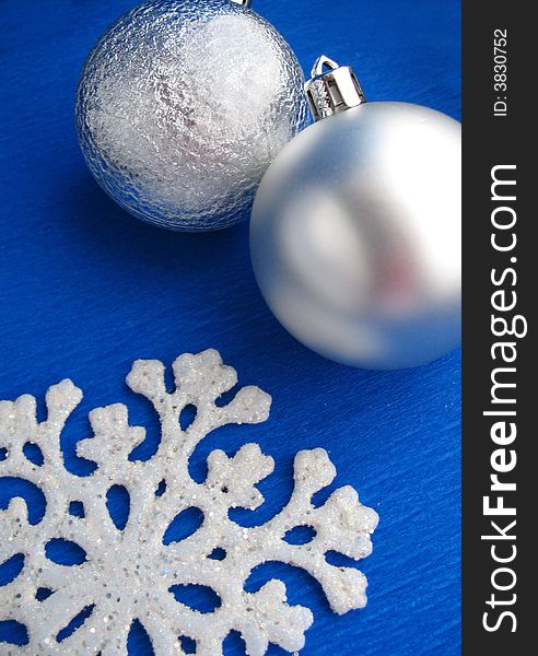 Christmas Two  white balls 
White snowflake 
blue background. Christmas Two  white balls 
White snowflake 
blue background