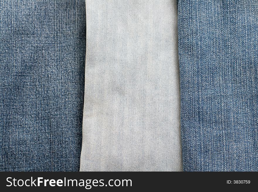 Three of jeans. Denim background different colors