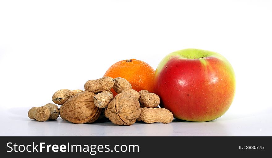 A variety of fruits with diferent nuts. Isolated over white space (for text). A variety of fruits with diferent nuts. Isolated over white space (for text).