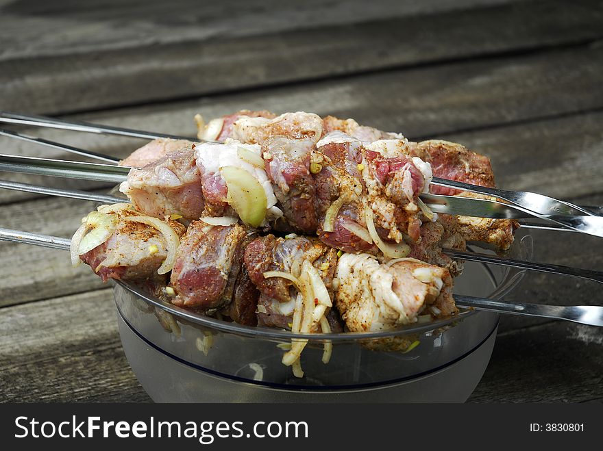 Fresh pork kebab with onion in the pan 8. Fresh pork kebab with onion in the pan 8