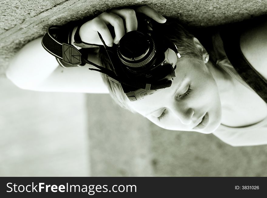 Tender young girl with the camera