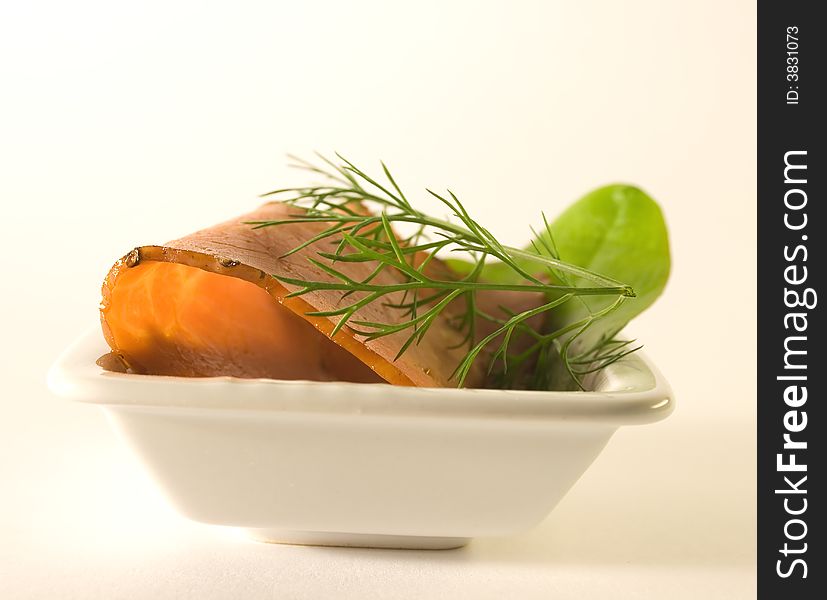 Meat slicing in the white plate over white background. Meat slicing in the white plate over white background