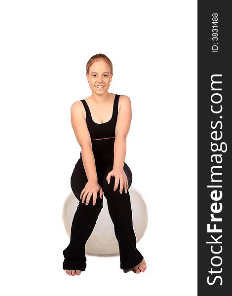 Earobics exercise ball with blond sitting on it. Earobics exercise ball with blond sitting on it