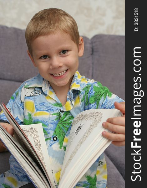 The Happy Boy Holds The Greater Book In Hands