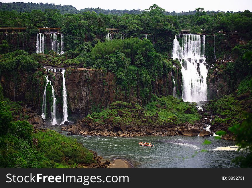 The Iguassu (or Iguazu) Falls is one of the largest masses of fresh water on the planet and divides, in South America, Brazil, Paraguay and Argentina. The waterfall system consists of 275 falls along 2.7 kilometres (1.67 miles) of the Iguazu River. Some of the individual falls are up to 82 metres (269 feet) in height, though the majority are about 64 metres (210 feet). The Iguassu (or Iguazu) Falls is one of the largest masses of fresh water on the planet and divides, in South America, Brazil, Paraguay and Argentina. The waterfall system consists of 275 falls along 2.7 kilometres (1.67 miles) of the Iguazu River. Some of the individual falls are up to 82 metres (269 feet) in height, though the majority are about 64 metres (210 feet).