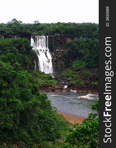 The Iguassu (or Iguazu) Falls is one of the largest masses of fresh water on the planet and divides, in South America, Brazil, Paraguay and Argentina. The waterfall system consists of 275 falls along 2.7 kilometres (1.67 miles) of the Iguazu River. Some of the individual falls are up to 82 metres (269 feet) in height, though the majority are about 64 metres (210 feet). The Iguassu (or Iguazu) Falls is one of the largest masses of fresh water on the planet and divides, in South America, Brazil, Paraguay and Argentina. The waterfall system consists of 275 falls along 2.7 kilometres (1.67 miles) of the Iguazu River. Some of the individual falls are up to 82 metres (269 feet) in height, though the majority are about 64 metres (210 feet).