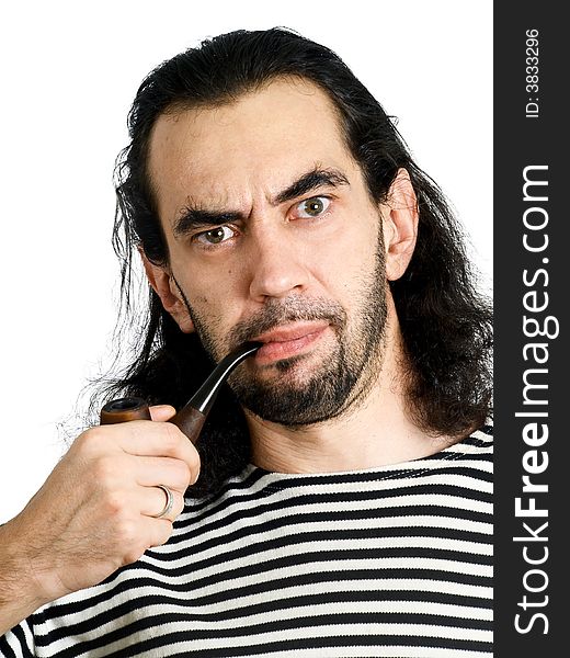 Aggressive unshaven man with pipe in sailor clothes