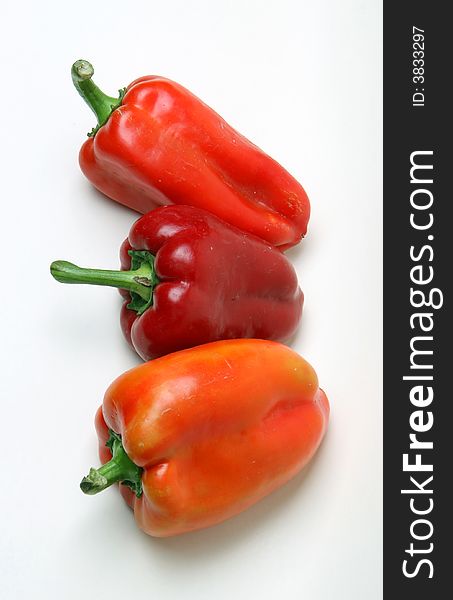 Red peppers over white background