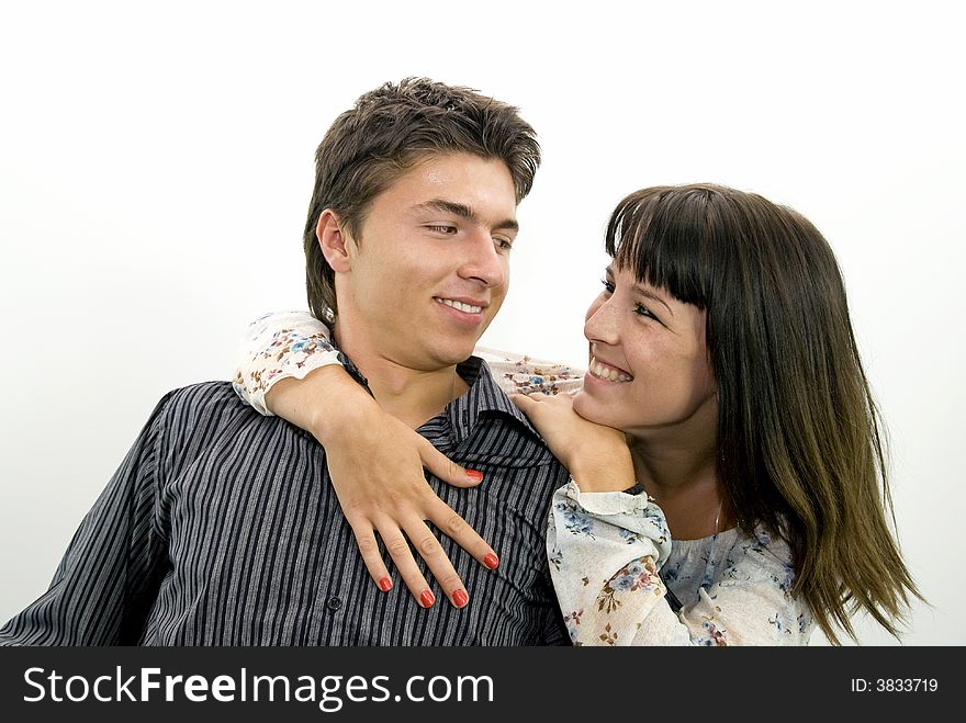 Cute young couple smiling to each other. Cute young couple smiling to each other