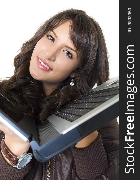 Young brunette girl with lap top computer over white. Modern communications.