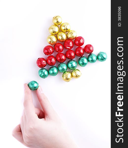 Pralines in the coloured paper/ sweet christmas tree