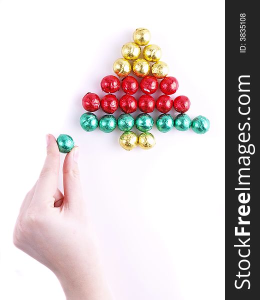 Pralines in the colorful paper/ sweet christmas tree