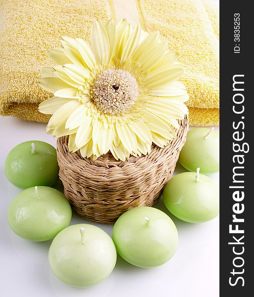 Flower, candle and yellow towel. Flower, candle and yellow towel