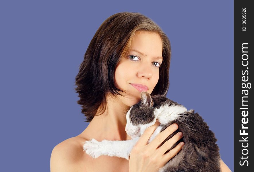 Young woman and old cat  on blue background. Young woman and old cat  on blue background