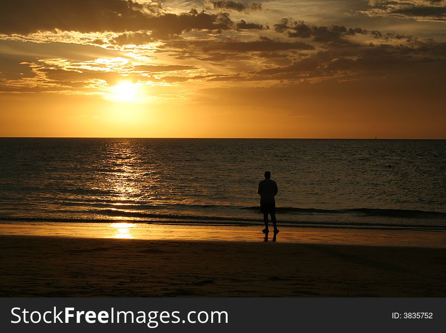 A man on Moreton Island at sunset