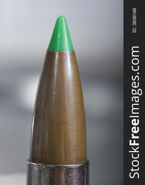 Green ballistic tip 300 mag bullet in nickel casing.