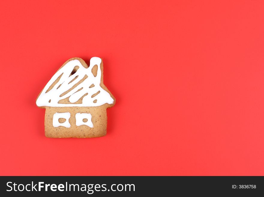 Gingerbread cookie on the red background