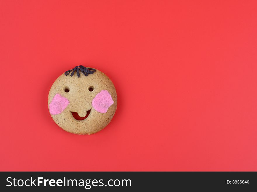 Smiling cookie on the red