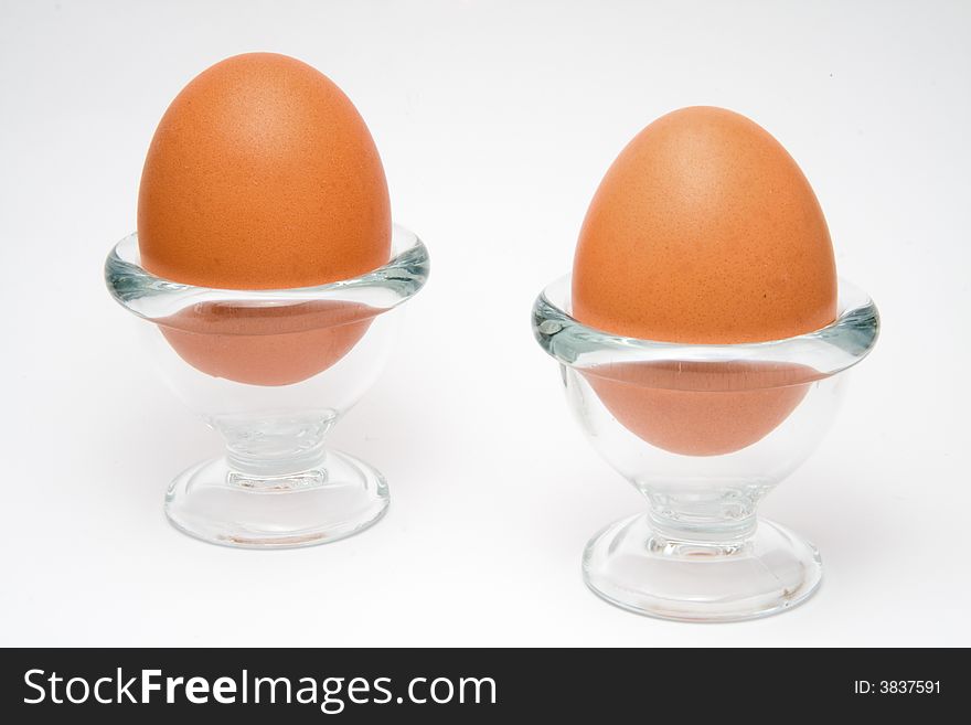 Two eggs in a glass cup