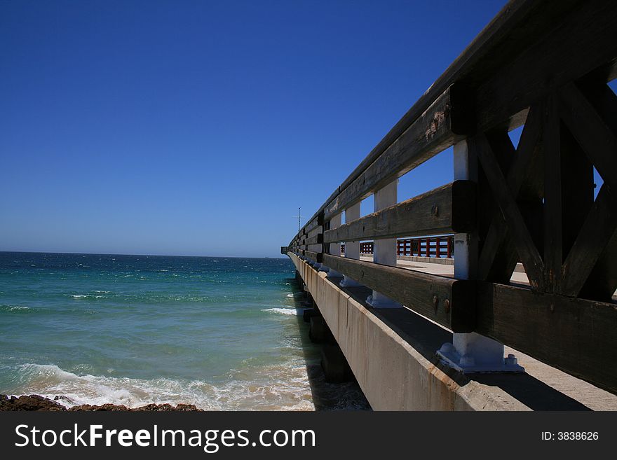 A pier at the beach on a hot day. A pier at the beach on a hot day