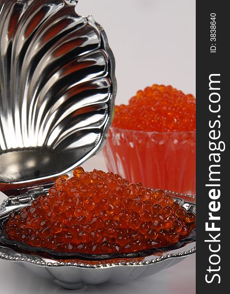 Red caviar on a white background