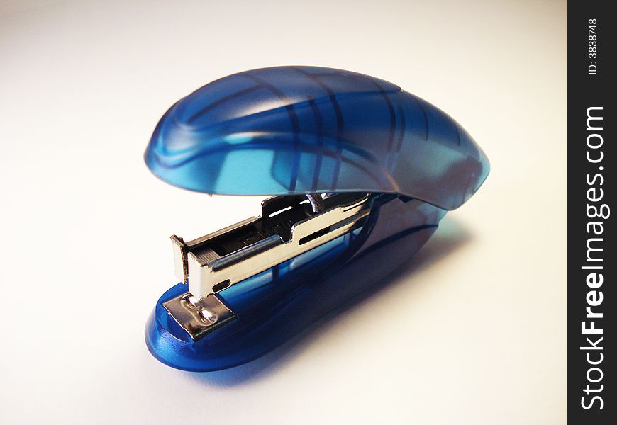 Close-up photograph of a blue stapler
