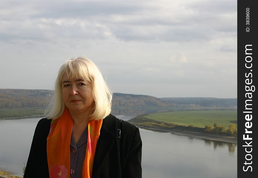 Portrait of the woman on a background of a river valley. Tom river, Tomsk, Siberia, Russia.