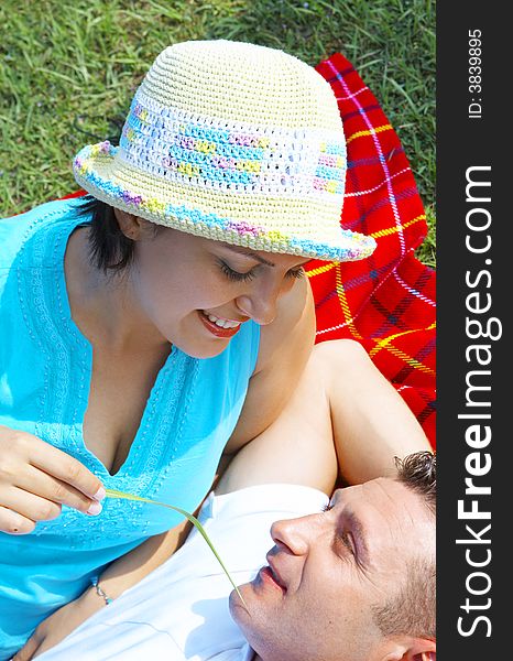 A portrait of attractive couple in summer environment. A portrait of attractive couple in summer environment