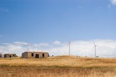 Forgotten Farmhouse And New Wind Turbines Stock Image Forgotten Farmhouse And New Wind Turbines Stock Image