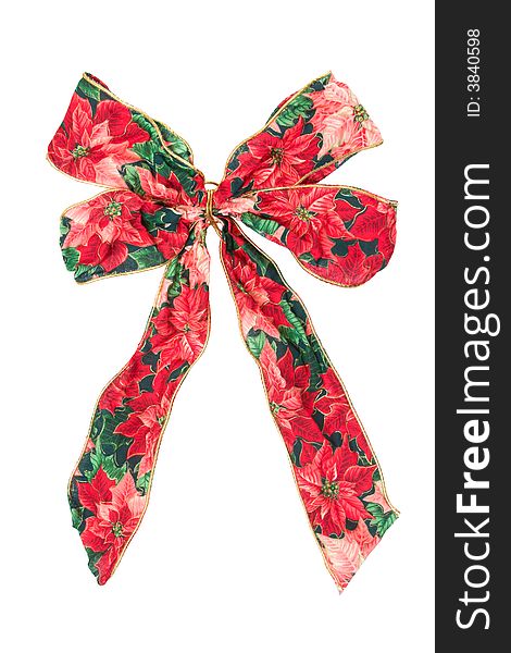 A large Christmas ribbon of poinsettia-print fabric. A large Christmas ribbon of poinsettia-print fabric.